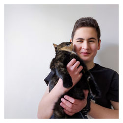Close-up of woman holding cat