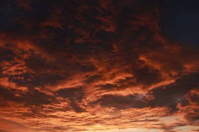 Low angle view of dramatic sky during sunset