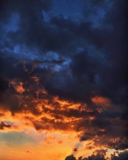 Scenic view of dramatic sky at sunset