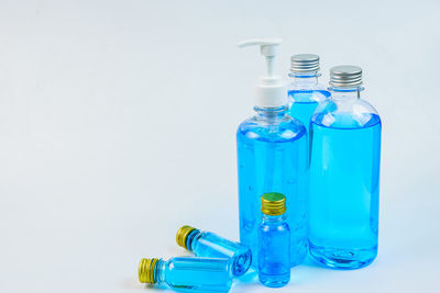 Close-up of blue bottle against white background