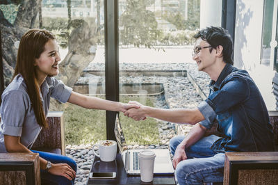 Young couple sitting on coffee