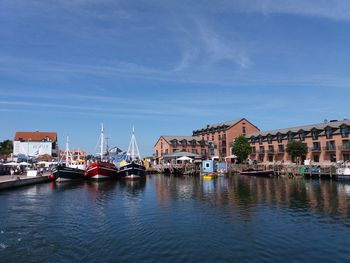 Boats moored at harbor