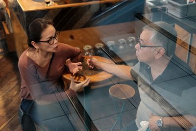 High angle view of people having food at restaurant