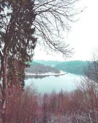 Scenic view of lake against sky at sunset