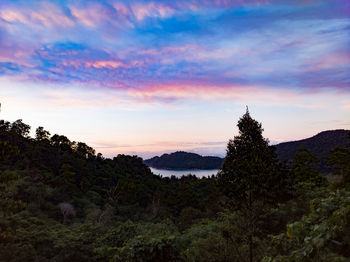 Scenic view of silhouette mountains against sky at sunset