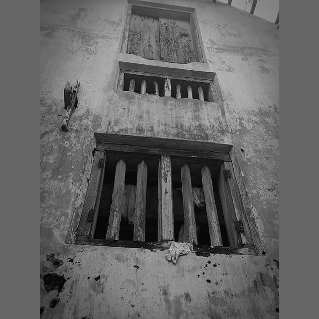 architecture, built structure, building exterior, low angle view, window, old, building, abandoned, wall - building feature, damaged, house, weathered, day, history, outdoors, exterior, sky, residential structure, obsolete, run-down