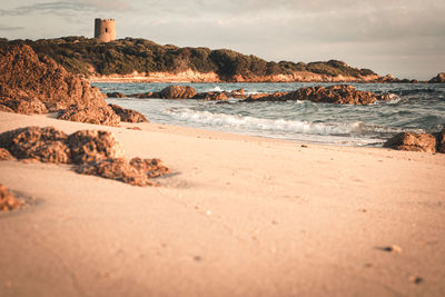 Surface level of beach against sky