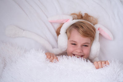 Cute baby boy sleeping on bed