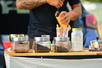 Midsection of man preparing food in restaurant