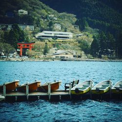 Boats moored on pier in lake ashinoko