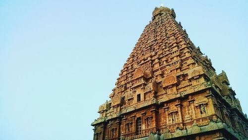 Low angle view of built structure against blue sky