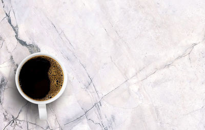 High angle view of coffee cup on table