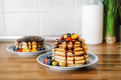 Close-up of pancakes in plate on table