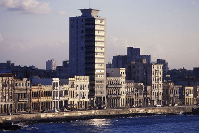 Modern buildings in city against sky