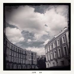 Low angle view of building against cloudy sky