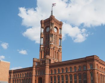 Low angle view of clock tower against sky