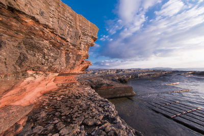 Scenic view of sea against cloudy sky