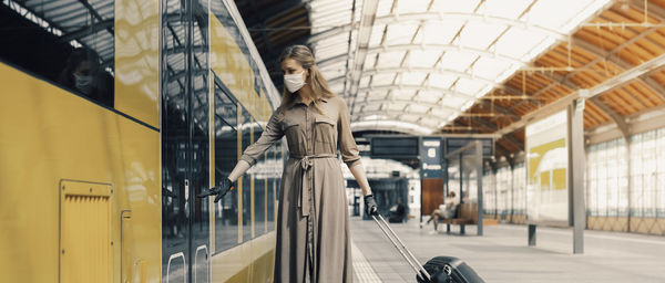 Statue of people at railroad station platform