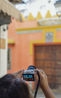 Man photographing with mobile phone