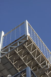 Low angle view of architectural detail of building against blue sky