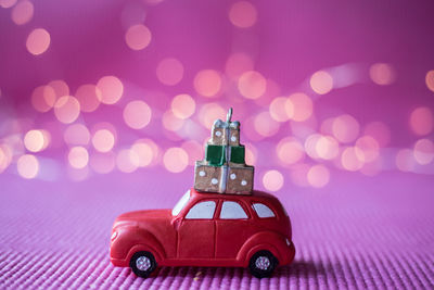 Close-up of toy car on purple fabric