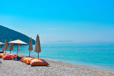 Scenic view of sea against blue sky