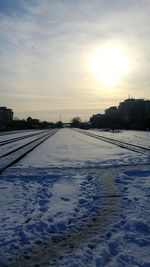 Scenic view of snow against sky during sunset
