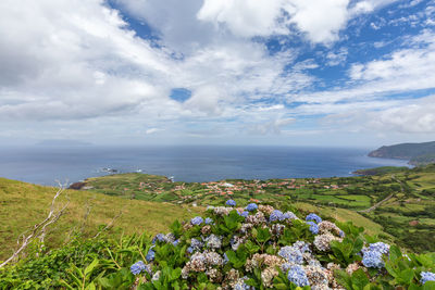 Scenic view of sea against cloudy sky