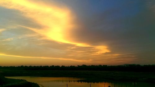 Scenic view of landscape at sunset