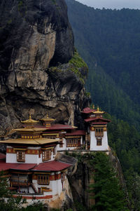 High angle view of building amidst trees and mountains