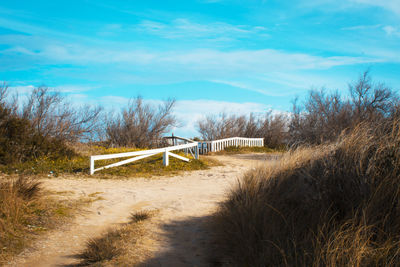 Sea-landscape-fence-sky-clouds-road-beach