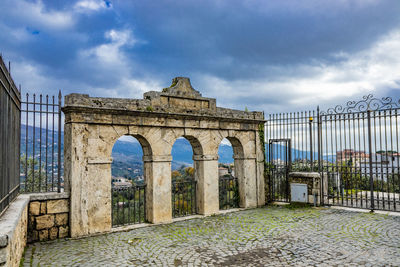 Old ruin building against cloudy sky