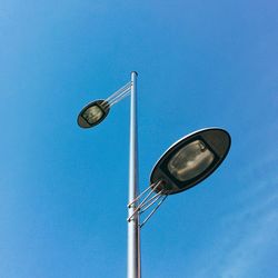 Low angle view of street light against sky