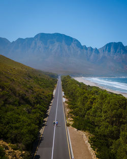 Road amidst mountains against sky