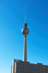 The television tower at alexanderplatz, berlins most famous landmark, on a sunny day