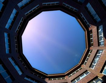 Low angle view of building against clear blue sky