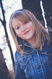 Portrait of smiling girl with blond hair