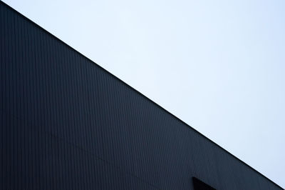 Low angle view of modern building against clear sky