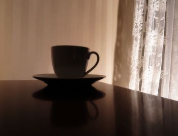 Close-up of coffee cup on table
