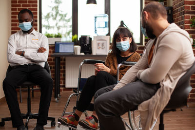 People sitting on chair in cafe