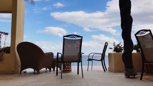 Chairs and tables against sky