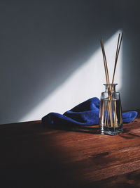 Flavor aroma sticks in vase on table.
