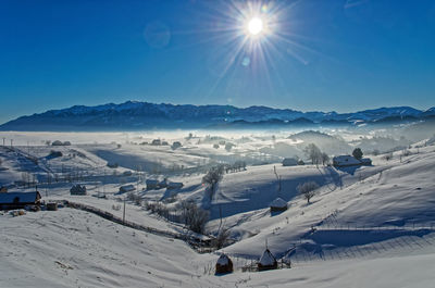 Scenic view of snowcapped mountains against sky