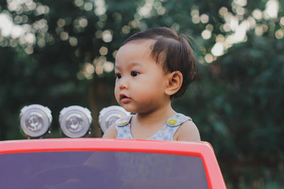 Portrait of cute boy looking away