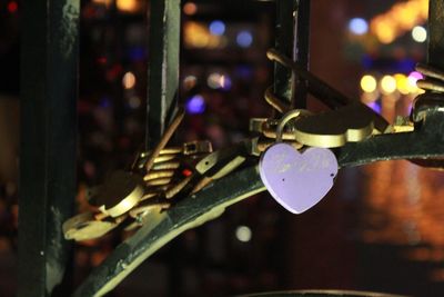 Close-up of padlocks on railing