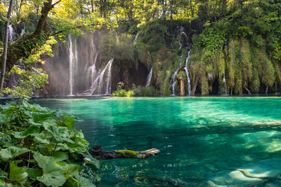 Waterfalls with turquoise colored lake