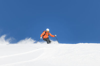 White fresh virgin snow during ski touring descent