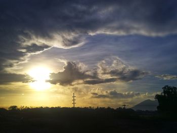 Silhouette landscape against sky during sunset