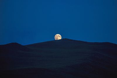 Low angle view of moon against clear sky