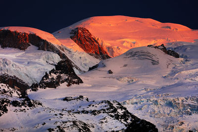 Scenic view of mountains against sky during winter